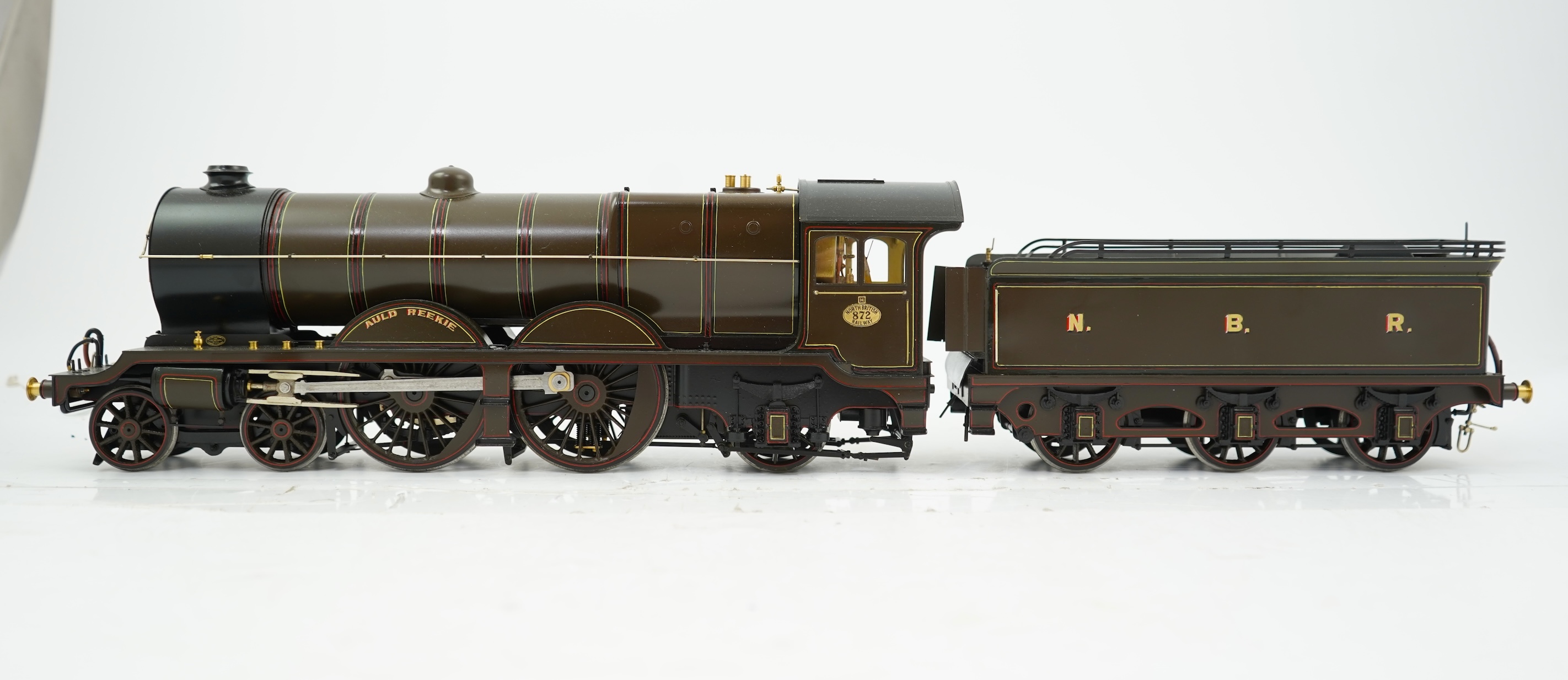 A Gauge One model of North British Railways H Class Auld Reekie 872, 4-4-2 Atlantic tender locomotive, the model has been left unpowered to allow for a high level of detailing of the valve gear and cylinders between the